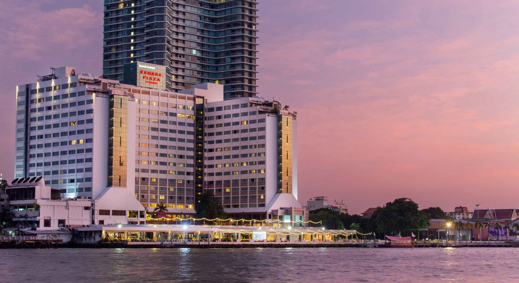 Ramada Plaza by Wyndham Bangkok Menam Riverside at sunset on the Chao Phraya River